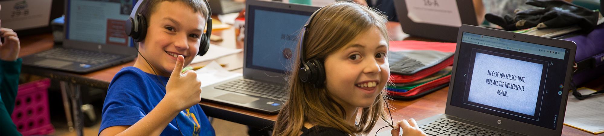 Two kids enjoying the computer